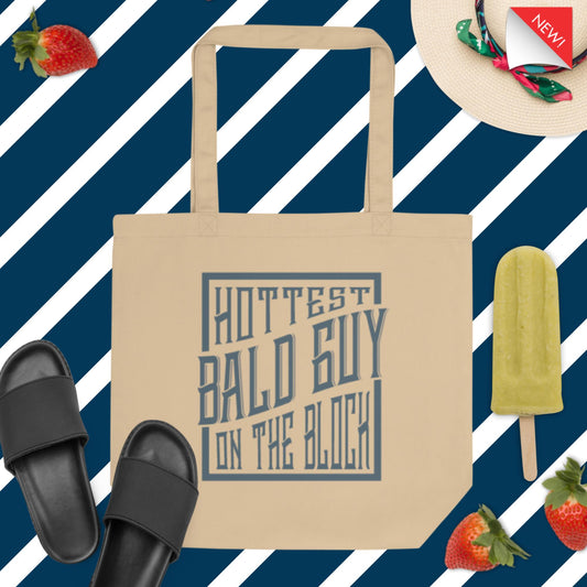 Be the cool guy and eco-friendly with the Hottest Bald Guy on the Block tote bag.