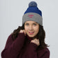 A happy wife is a warm wife wearing our pom-pom  beanie - the perfect accessory for any fashion-conscious woman.